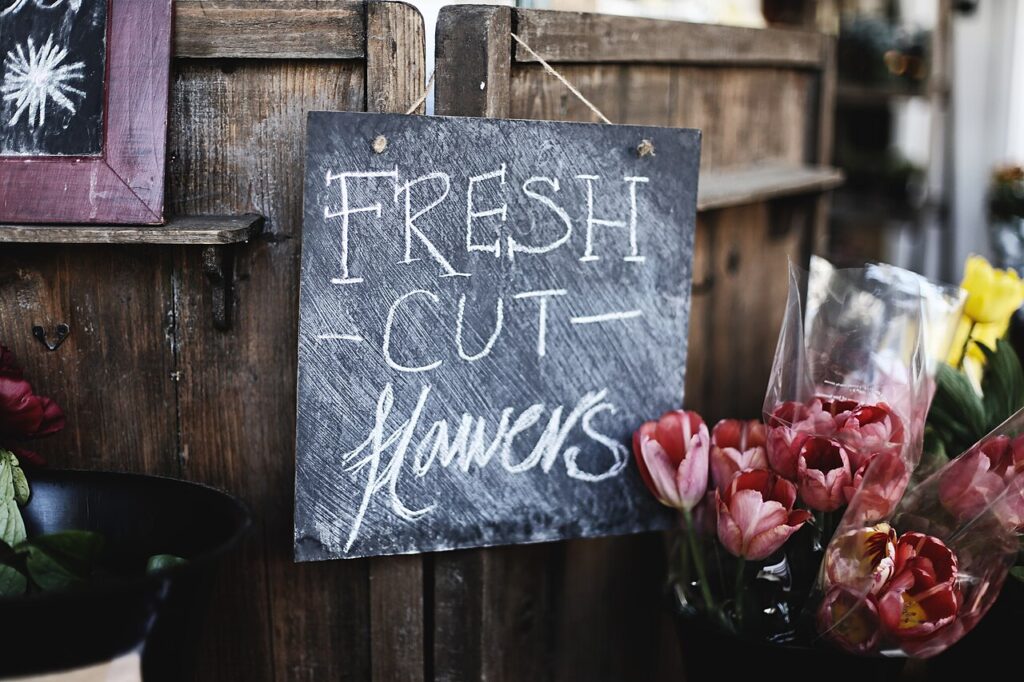 A florist&rsquo;s table of fresh cut flowers ready to be arranged (stock photo)